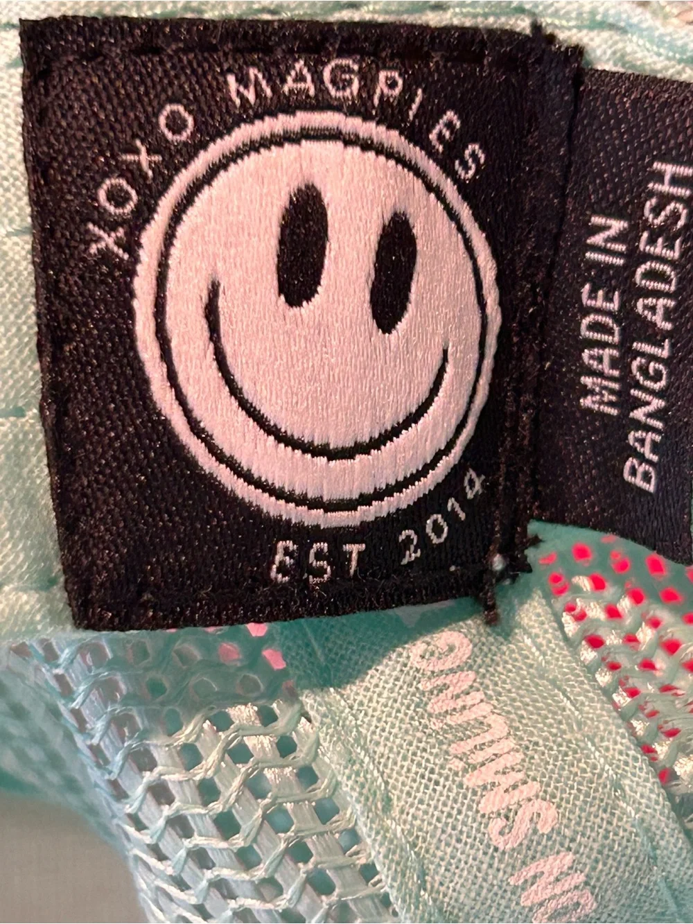 XOXO Magpies Kids Smiley Logo Trucker Hat in Mint